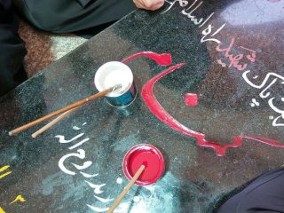 رنگ آمیزی قبور شهدا در فراهان